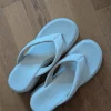 Comfortable white wedge mules