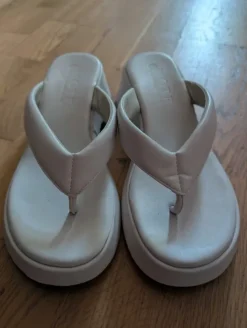 Comfortable white wedge mules