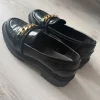 Even&Odd black chunky loafers with gold chain