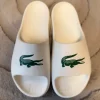 Lacoste Slides / Badelatschen weiß grün